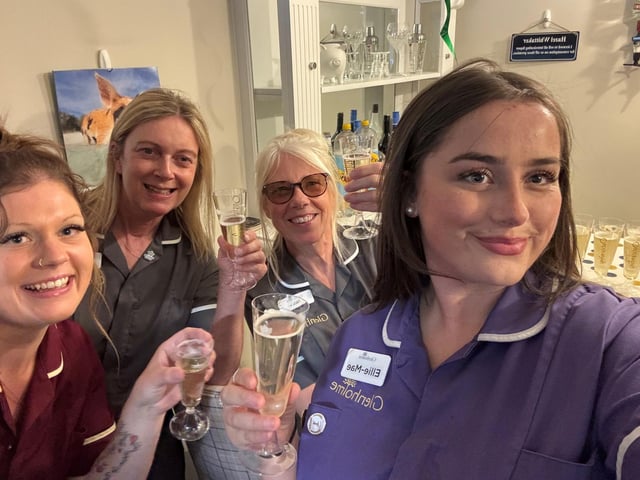 Care staff celebrate.