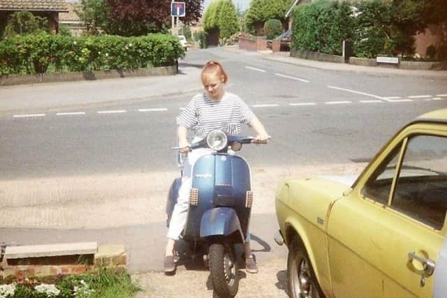 Sam on one of her first scooters as a teen