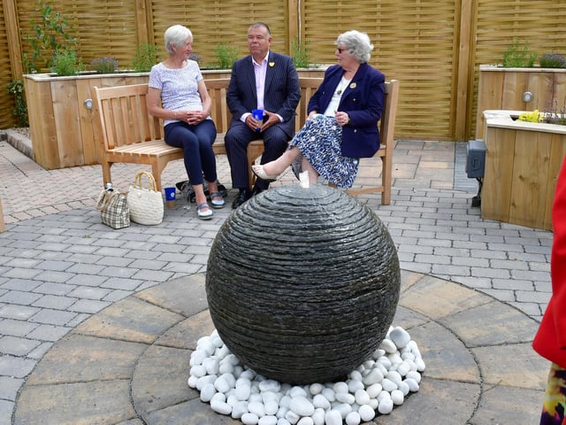 Professor Sir Jonathan Van-Tam talking to guests Jenny Barton of Boston, and Evelyn Castle of Kirton.