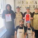 Narinder Singh and the Mermaid Fisheroes team with their quality accreditation.