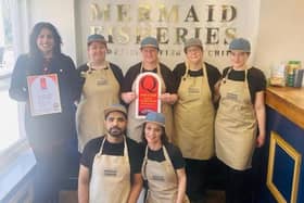 Narinder Singh and the Mermaid Fisheroes team with their quality accreditation.