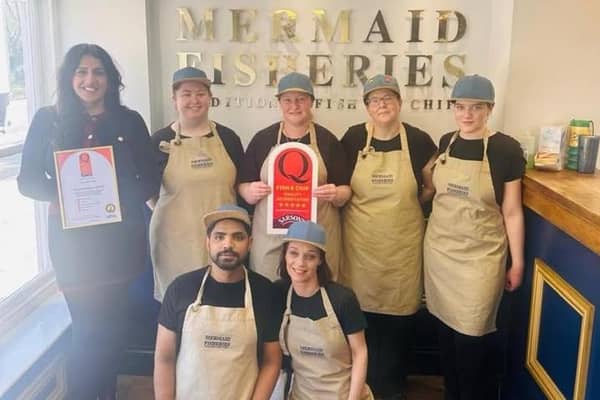 Narinder Singh and the Mermaid Fisheroes team with their quality accreditation.