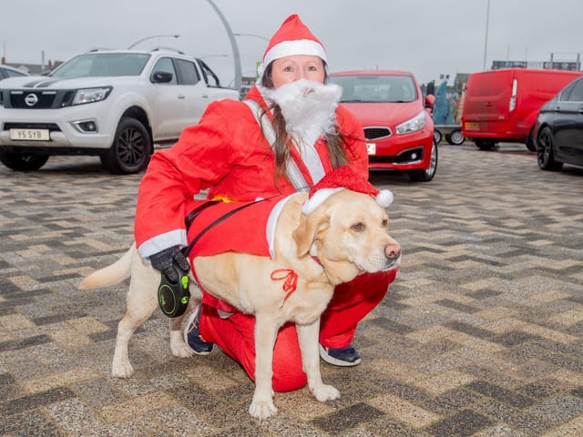 Emma Dewey and Lucy the dog ready to join the runners.