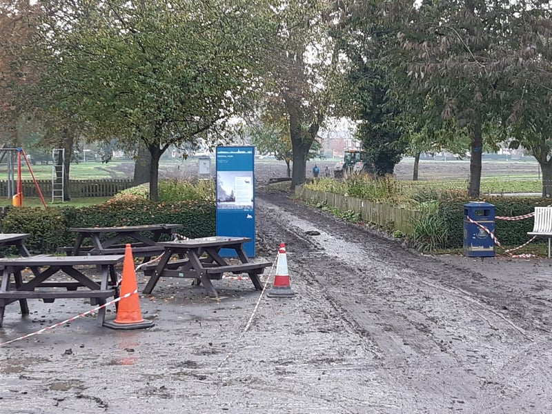 The mud-strewn entrance to Boston's Central Park.
