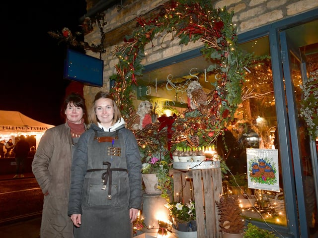 With their decorated window. L-R Philippa Altus and Hannah North of Petal and Stalk. Photo: David Dawson