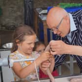 Butcher Nick Bradley showed all ages the way to make sausages