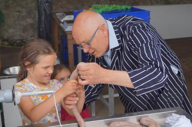 Butcher Nick Bradley showed all ages the way to make sausages