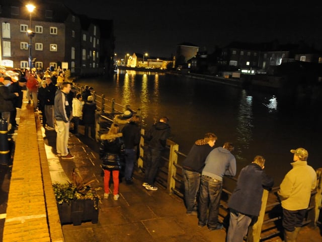 People gathered alongside the banks of the Haven in Boston after a flood warning was issued for the town. Unlike the previous month when the town was hit by major flooding, high tide brought no significant issues.