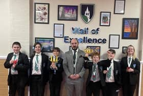The team is congratulated at the Academy by Principal Mr Hermiston.
