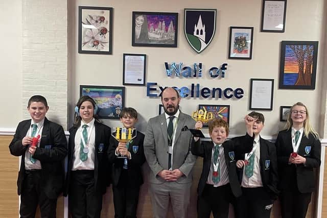 The team is congratulated at the Academy by Principal Mr Hermiston.