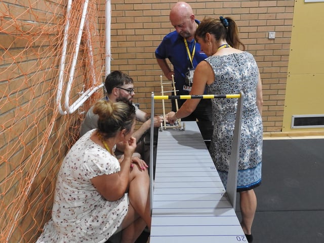 The St George's Academy staff team testing their weight powered vehicle. Photo: AH
