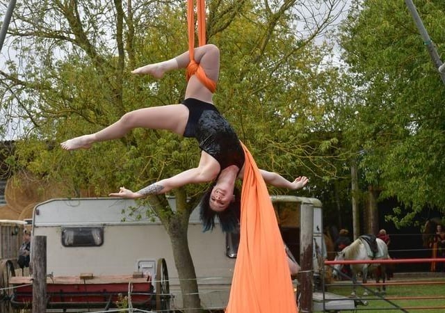 Member of Creative Heights Emily Chalder doing a silks performance