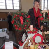 Ann Garrill with her Christmas wreaths stall at the Crafts By Candlelight fair in Silk Willoughby Church.