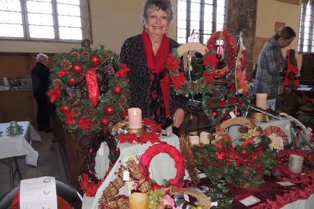 Ann Garrill with her Christmas wreaths stall at the Crafts By Candlelight fair in Silk Willoughby Church.