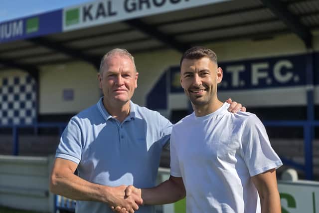 Trinity boss Russ Wilcox welcomes new signing Jonny Margetts.