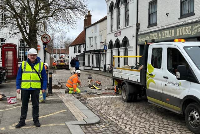 Coun William Gray, who represents Horncastle, with the county council highways team at work in the town centre. (PHOTO BY: Lincolnshire County Council)
