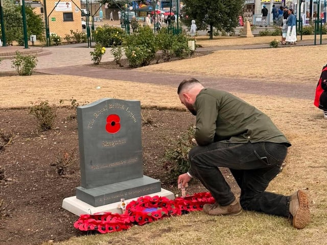 A veteran pays his respects at the RBL branch's war memorial.