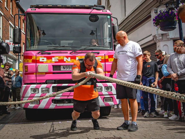 Justin Coulson, of Boston, pulling a fire engine in Strait Bargate.