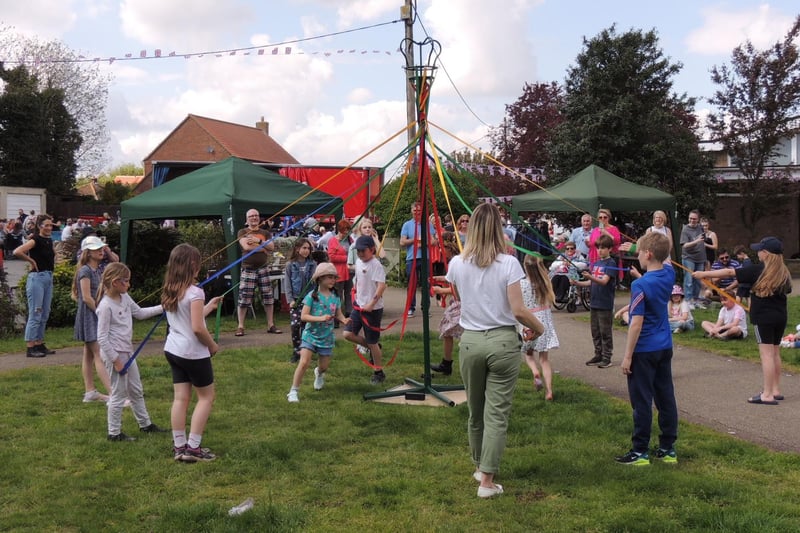 Digby School children do May pole dancing on the green for the coronation event.