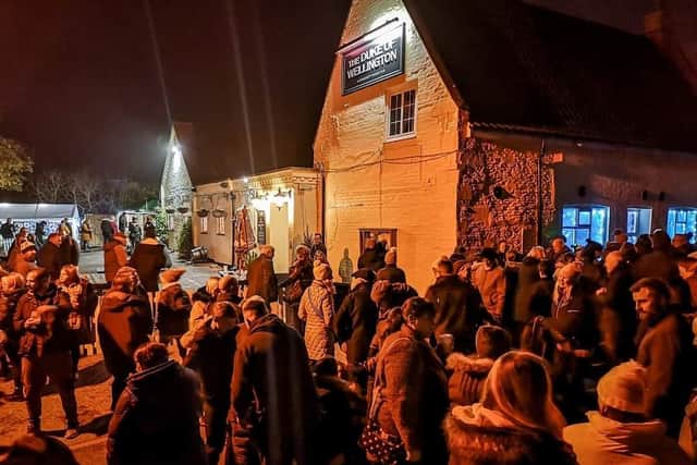 Crowds for the Duke Jingle Advent window launch event. Photo: Katie Cook