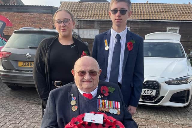 Burma Star veteran Alfred Conway with great-grandchildren Sarah Jayne, 15, and James Carpenter, 14, who laid the wreath on his behalf at Alford memorial.