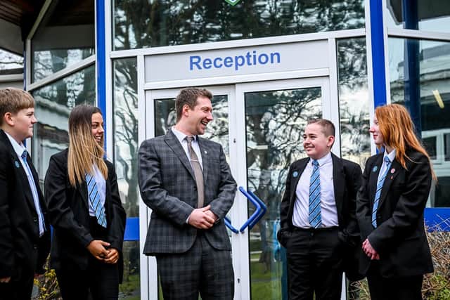 Jake Bailey, the new Principal at Somercotes Academy with students. Photo by Jon Corken