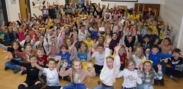Children at Gosberton Academy give cheers for Children in Need during their assembly.