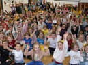 Children at Gosberton Academy give cheers for Children in Need during their assembly.