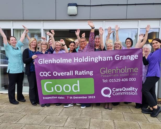 Holdingham Grange Home Manager, Rebecca Nisbet celebrates their recent successful CQC review results with staff.
