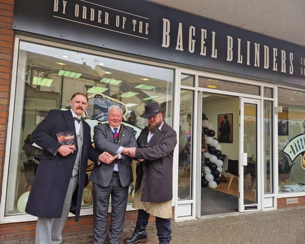 Characters based on the TV series Peaky Blinders welcome Mayor of Skegness Coun Pete Barry to the new Bagel Blinders cafe at the Hildreds Centre in Skegness.