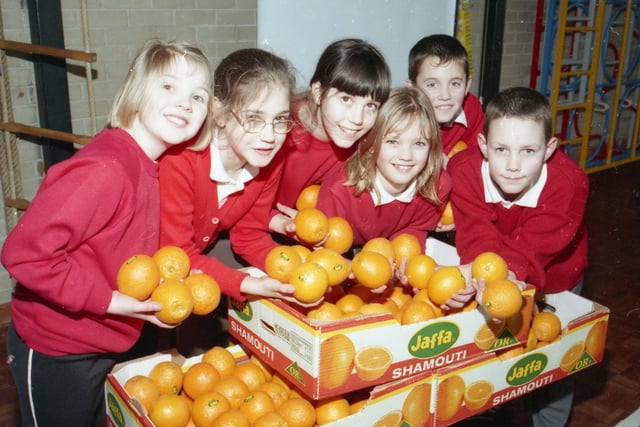 Children from Hawthorn Tree School, Boston, alongside some tasty lesson materials - oranges donated by Asda. Pictured are Sophie Hilton, Kimberley Gilchrist, Ruth Dawson, Emma Lilly, Lee Melton and Joe Harrison.