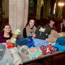 St George's Academy students giving out free blankets and coffee at St Deny's Church on Saturday. From left - Jessica Annan 18, Ranya Tran 18, Ellis Jackson 17, with Rev Philip Johnson.