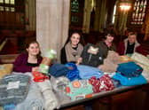 St George's Academy students giving out free blankets and coffee at St Deny's Church on Saturday. From left - Jessica Annan 18, Ranya Tran 18, Ellis Jackson 17, with Rev Philip Johnson.