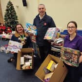 The Salvation Army's Terry Carpenter and Ida Franklin, right, 'boxing up' with Lincolnshire Co-op's Mary-Jane Storr. Image: Dianne Tuckett