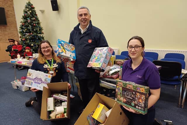 The Salvation Army's Terry Carpenter and Ida Franklin, right, 'boxing up' with Lincolnshire Co-op's Mary-Jane Storr. Image: Dianne Tuckett
