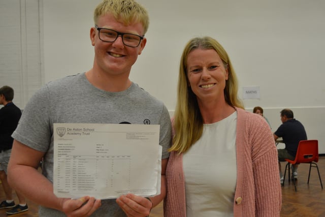 Rhys Sweeting celebrating 10 good grade passes which has secured his place at John Leggott College for A-levels in Maths, Physics and Engineering. Pictured with his mum, Helen.