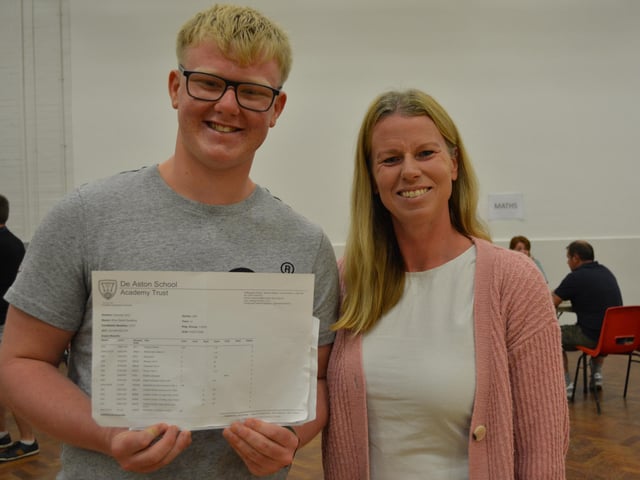 Rhys Sweeting celebrating 10 good grade passes which has secured his place at John Leggott College for A-levels in Maths, Physics and Engineering. Pictured with his mum, Helen.