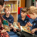 Osbournby pupils reading with their teacher. Photo: CIT Academies