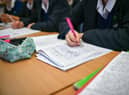 Students write in their exercise books in class at Royal High School Bath, which is a day and boarding school for girls aged 3-18 and also part of The Girls' Day School Trust, the leading network of independent girls' schools in the UK. 