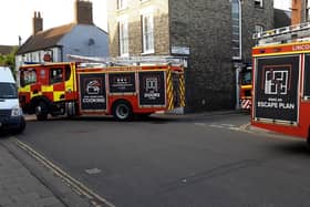 Fire appliances exit Pulvertoft Lane, Boston, following an explosion.