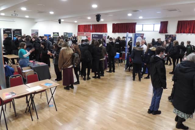 Hundreds of students in one of two rooms full of exhibitors at the St George's Academy careers fair.