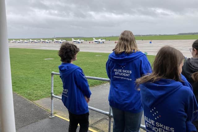 Jon Egging Trust students watch planes on the flight line at RAF Cranwell