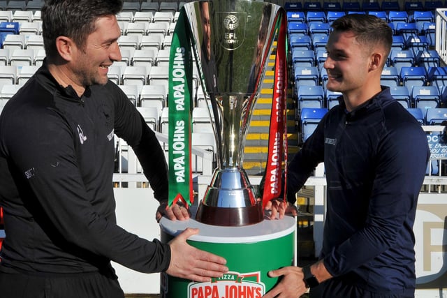 Graeme Lee and Luke Molyneux looking at The Papa John's Trophy .