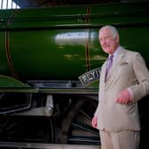 King Charles in front of The Flying Scotsman at Pickering Station