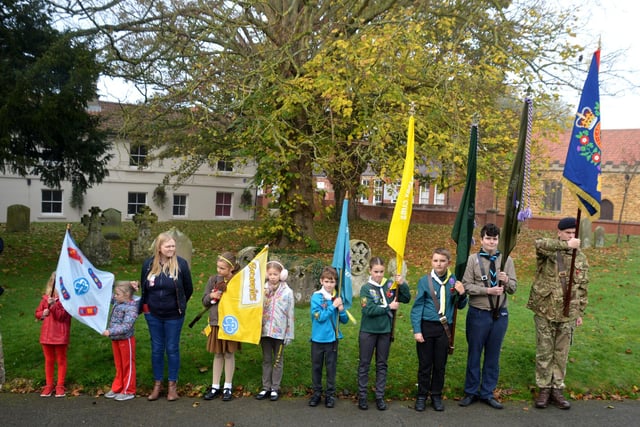 Representatives from local uniformed groups with their flags