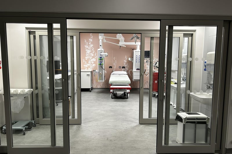 One of the eight resuscitation cubicles to care for the sickest patients needing the highest level of emergency care. Currently, the hospital has four. The first set of doors leads to an area where staff can 'don and doff', that is, put on and take off personal protective equipment. The cubicles also have negative air pressure to help prevent the spread of infection.