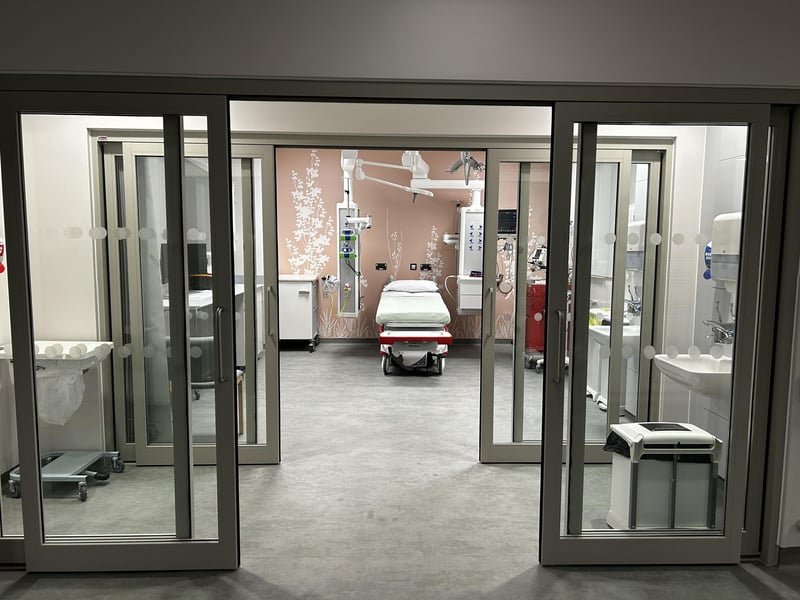One of the eight resuscitation cubicles to care for the sickest patients needing the highest level of emergency care. Currently, the hospital has four. The first set of doors leads to an area where staff can 'don and doff', that is, put on and take off personal protective equipment. The cubicles also have negative air pressure to help prevent the spread of infection.