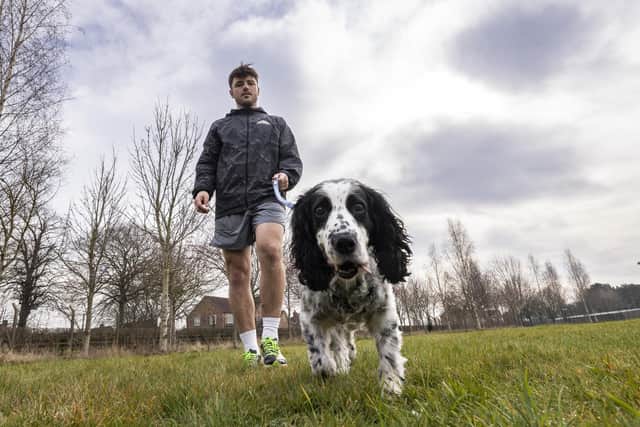 Flt Lt Aaron Eyett and Stanley, his spaniel, are set to do a fundraising London Marathon run for Spaniel Aid UK. Photo: RAF