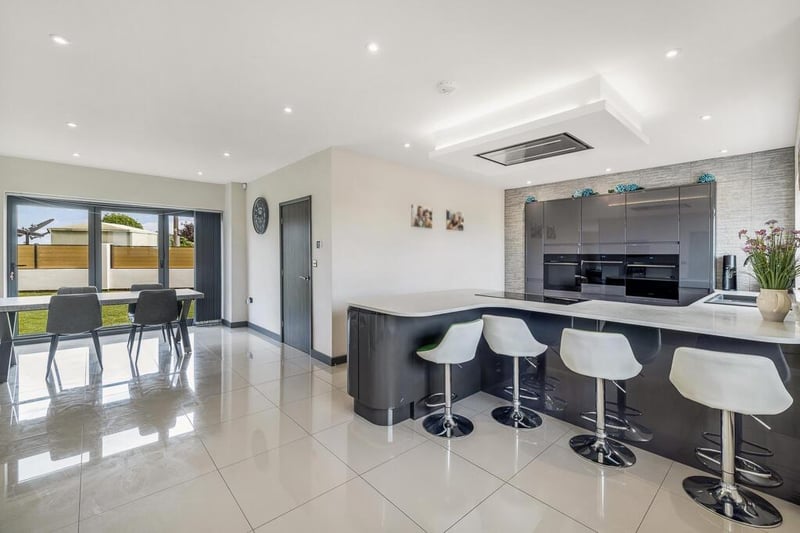 The dining room and kitchen areas.