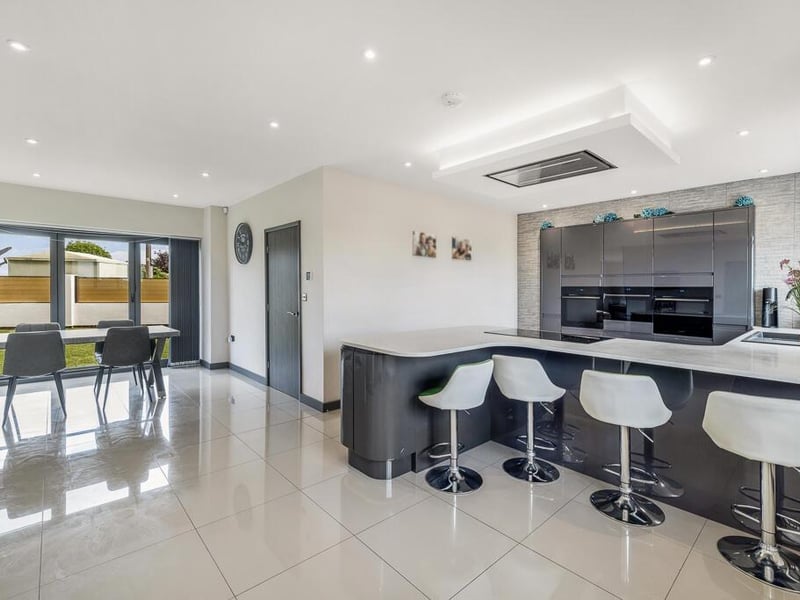 The dining room and kitchen areas.